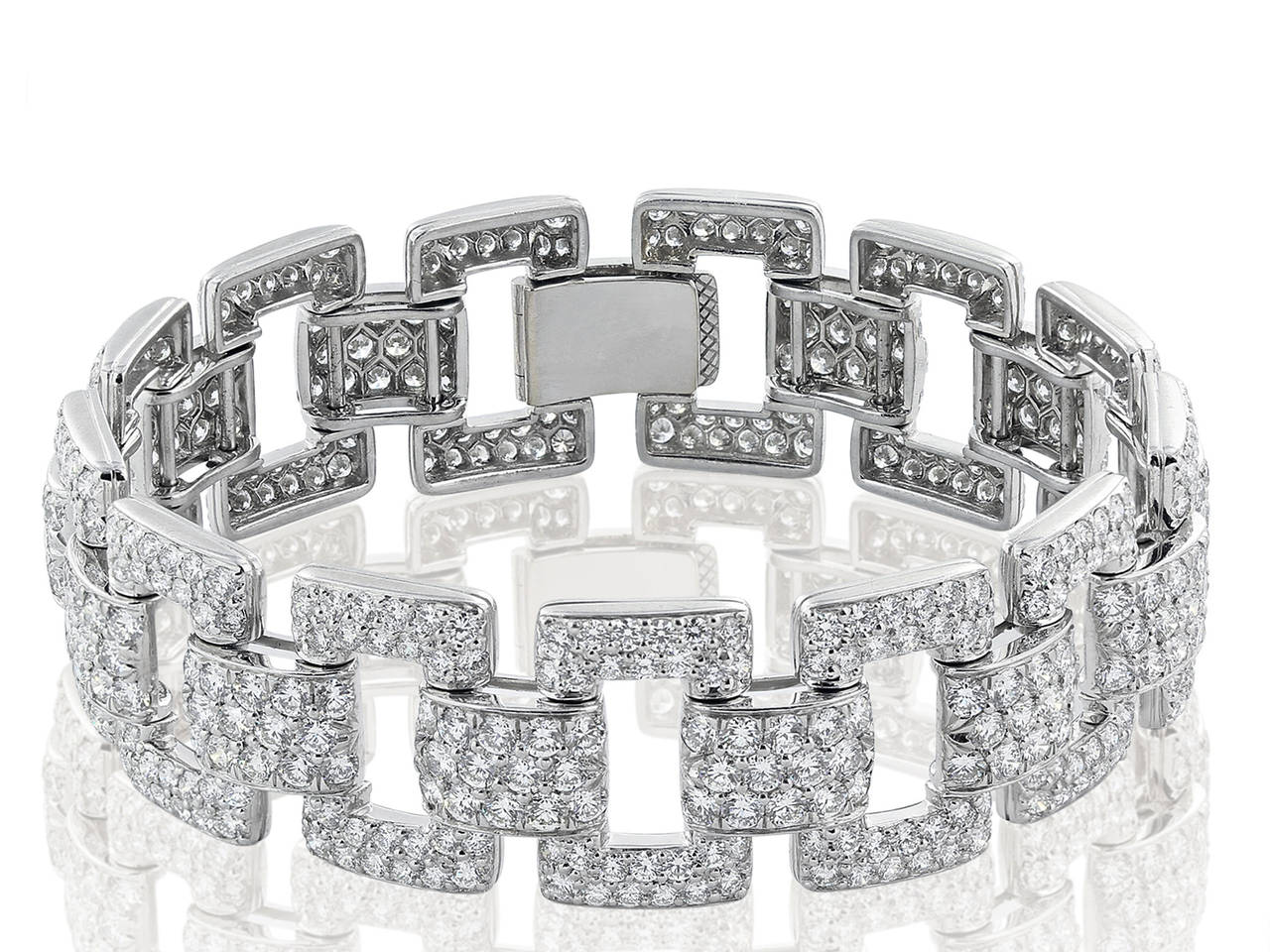 Platinum flexible rectangular and bar link bracelet consisting of 522 pave set round brilliant cut diamonds having a total weight of 15.13 carats and an average approximate color and clarity of G/VS2.