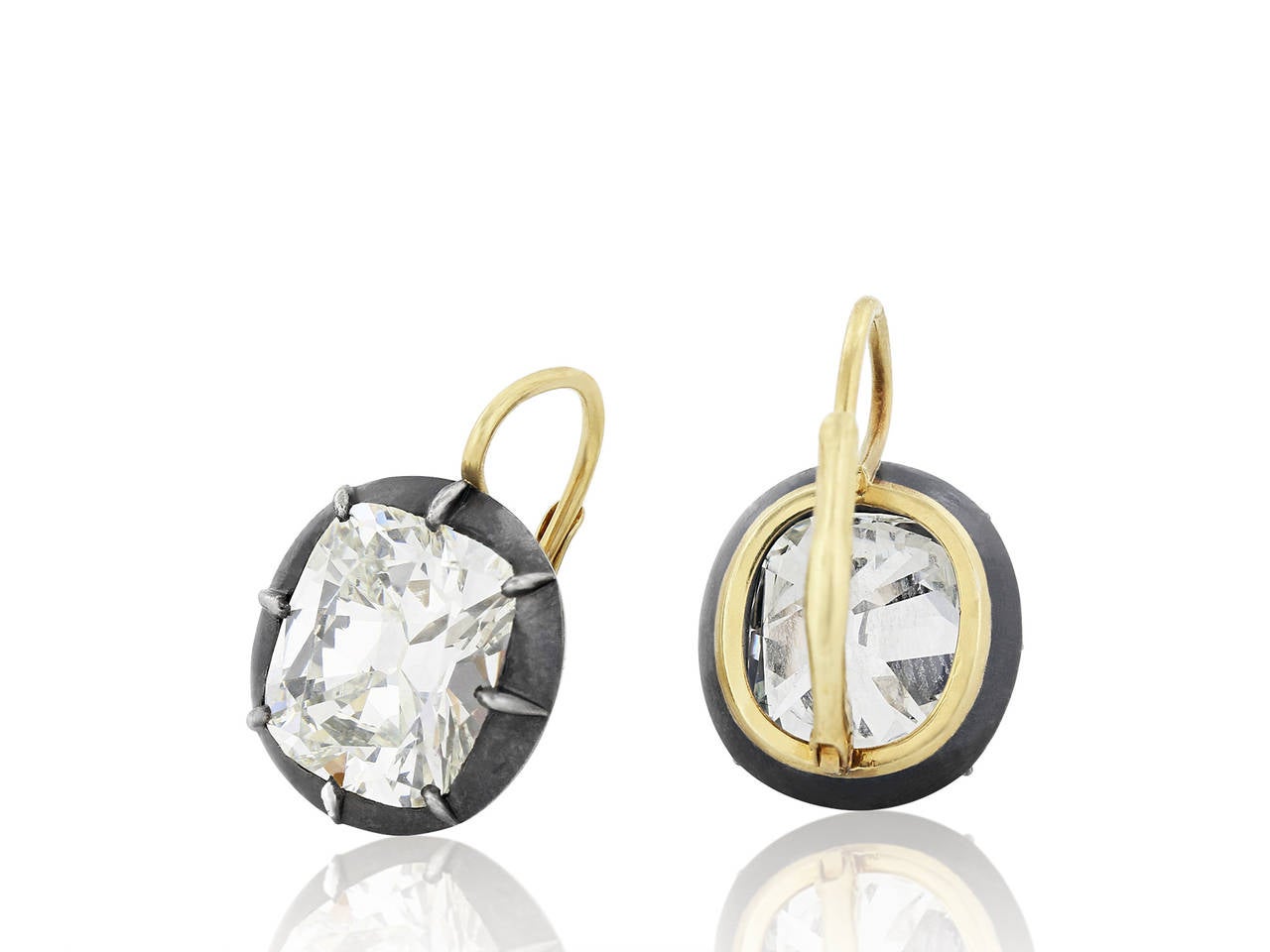 Sterling silver on 18 karat yellow gold vintage style drop earrings consisting of 2 cushion cut diamonds having a total weight of 8.78 carats, one diamond weighing 4.36 carats having a color and clarity of J/VS1, the second weighing 4.42 carats