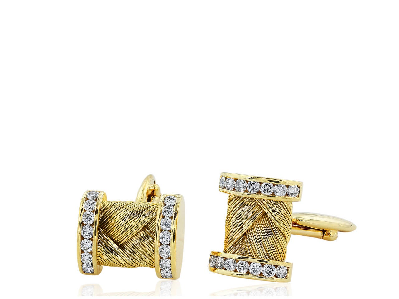 18 karat yellow gold cufflink & stud set consisting of 2 cufflink pieces and 4 studs.  The pieces are set with 68 round brilliant cut diamonds having a total weight of 1.67 carats.