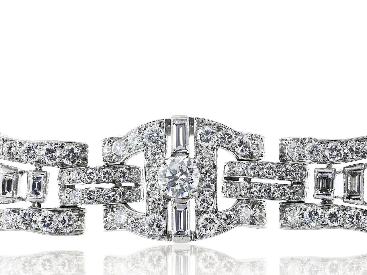 Platinum Oscar Heyman, Art Deco bracelet, consisting of Round brilliant and baguette diamonds having an estimated total weight of 12 carats and approximate color and clarity of F/VS2.