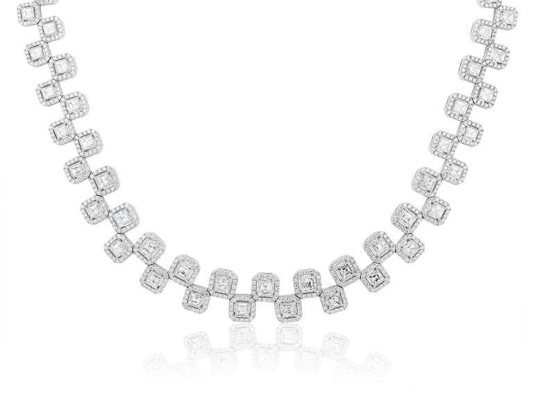 18 karat white gold double row necklace consisting of 74 Asscher cut diamonds having a total weight of 20.62 carats set with 1,184 round brilliant cut diamonds having a total weight of 7.07 carats.