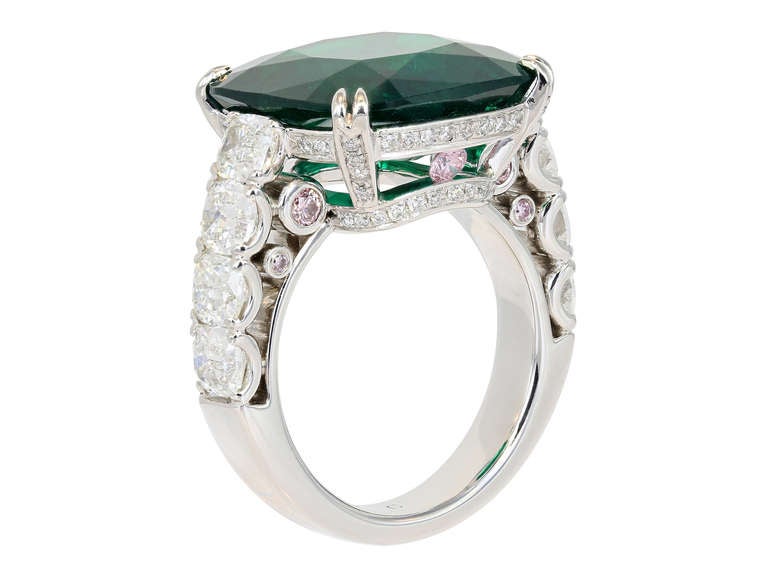 Platinum custom made solitaire ring consisting of 1 cushion cut Columbian emerald weighing 10.14 carats, measuring 15.35 x 15.26 x 6.52mm with GRS certificate #GRS2008-120989 stating minor Colombia, the stone is set with 2.45 carats total weight of