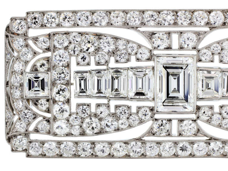 Platinum Art Deco open work Old European & emerald cut diamond pin.