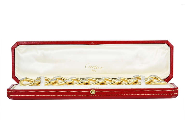 18 karat yellow gold vintage flexible open link bracelet set with approximately 7.00 carats total weight of round brilliant cut diamonds, signed Cartier France Circa 1960