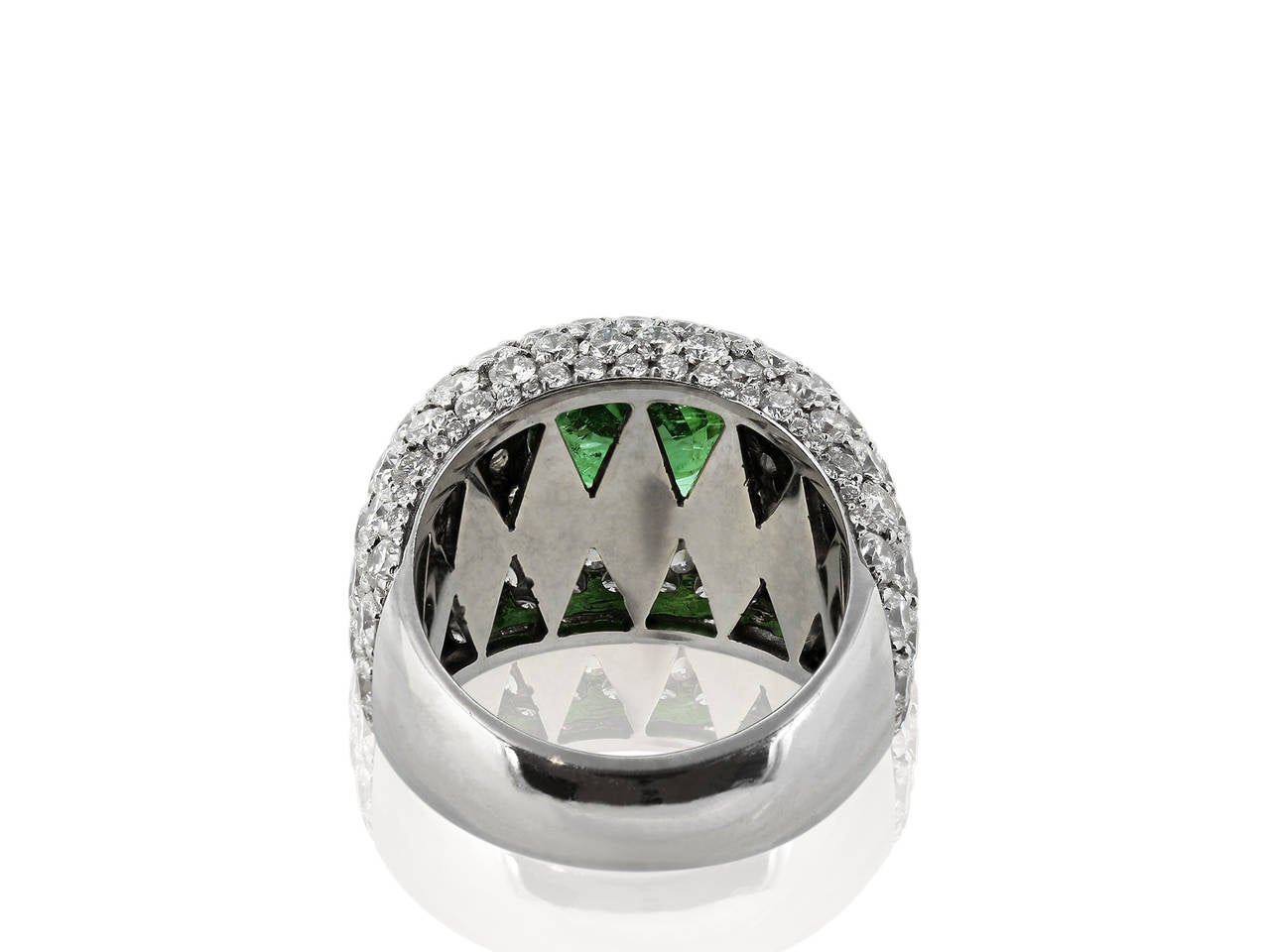 18 karat white gold dome ring consisting of 1 oval shaped green Parabia Tourmaline weighing 2.69 carats with GIA certificate #6107027812  stating Brazilian Paraiba Tourmaline set with 4.91 carats of round brilliant cut diamonds.