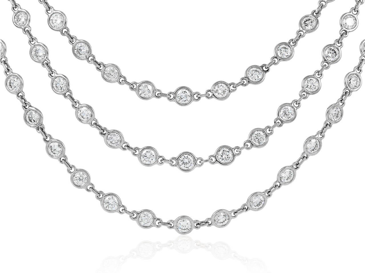 18 karat white gold 63.5 inch by the yard style necklace consisting of 114 bezel set round brilliant cut diamonds having a total weight of 27.35 carats set with an additional .47 carats of full cut diamonds in the clasp.