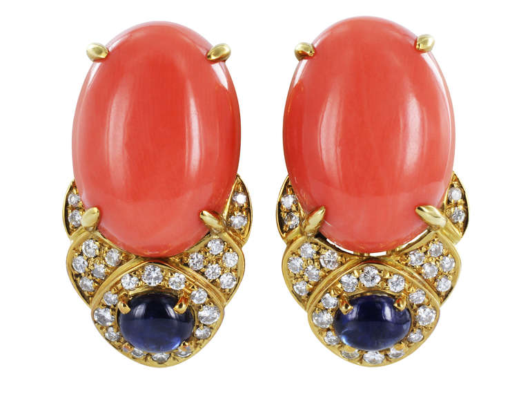 18 karat yellow gold necklace and earrings set consisting of 1 piece of oval shaped coral set with round brilliant cut diamond and cabochon sapphire and coral accents, made by G. Petochi Rome.