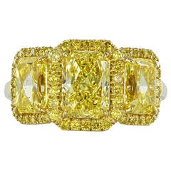 Fancy Intense GIA Certified Yellow Diamond Gold Three-Stone Engagement Ring