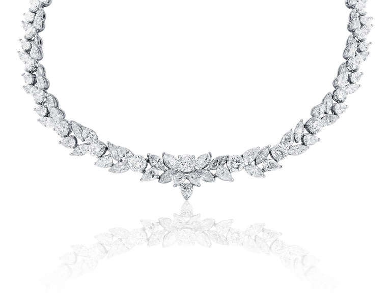 One ladies platinum fancy shape diamond Harry Winston style wreath necklace consisting 7 GIA certified round brilliant cuts along with a mixture of marquise cut, and pear shape diamonds all having a total weight of 48.95 having a color and clarity