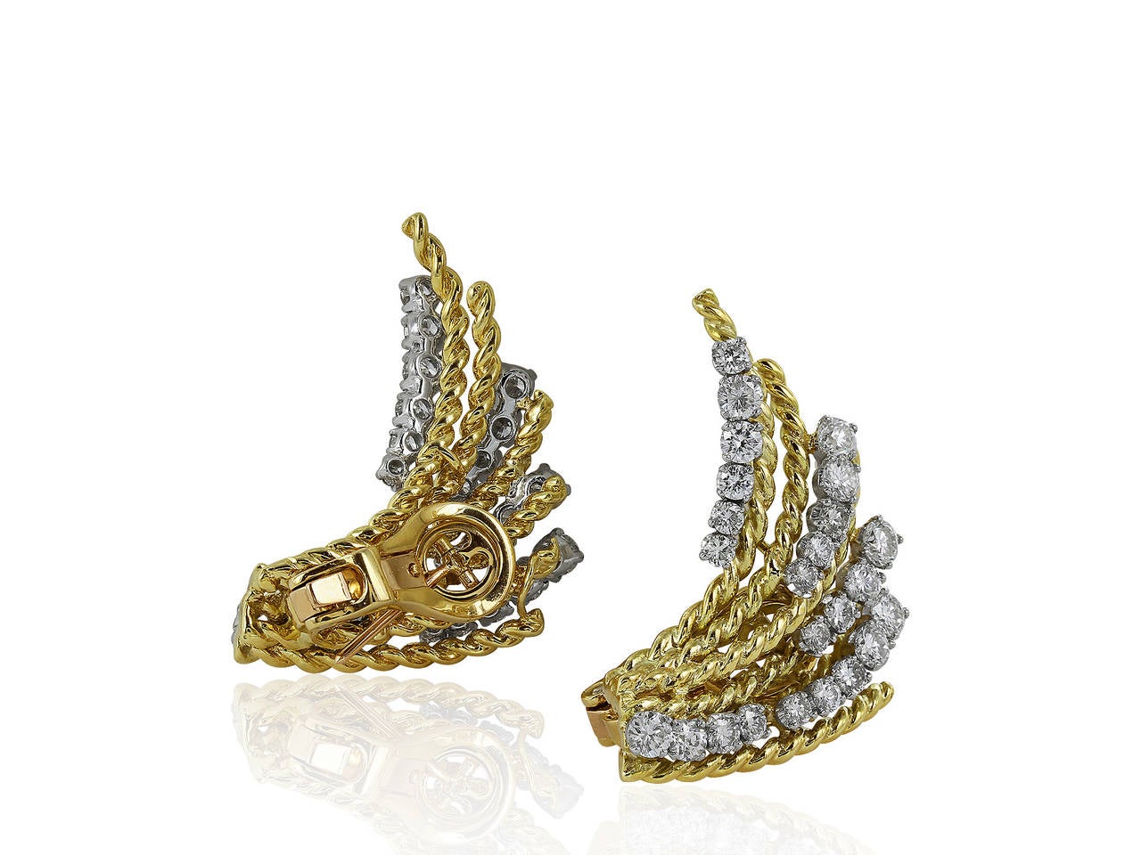Two tone 18 karat yellow and white gold spray estate earring consisting of 48 round brilliant cut diamonds having a total weight of approximately 2.50 carats.