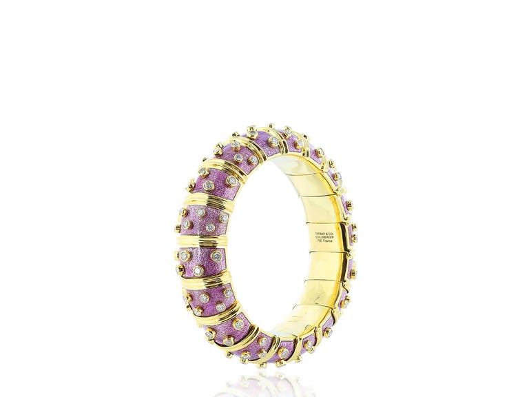 Estate 18 karat yellow gold wide purple paillonne enamel Tiffany & Co. Schlumberger bangle bracelet with bezel set round brilliant cut diamond accents.