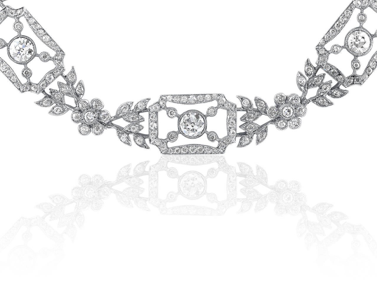 Platinum and diamond open work vintage style necklace consisting of approximately 15.00 carats total weight of round brilliant cut diamonds.