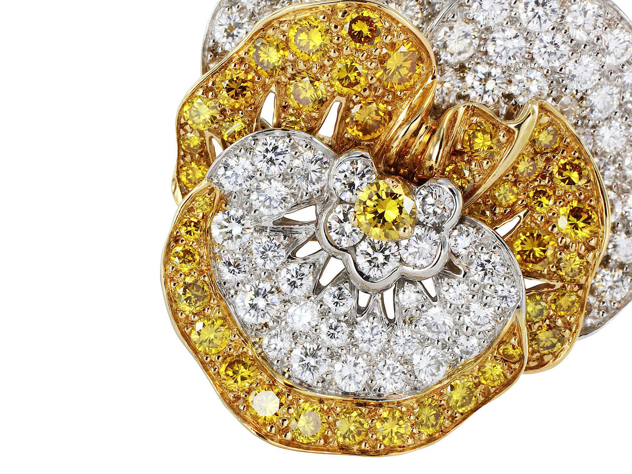 Platinum and 18kt yellow gold pansy brooch consisting of 117 colorless and natural canary round brilliant cut diamonds having a total weight of 5.54, the brooch is signed Oscar Heyman.