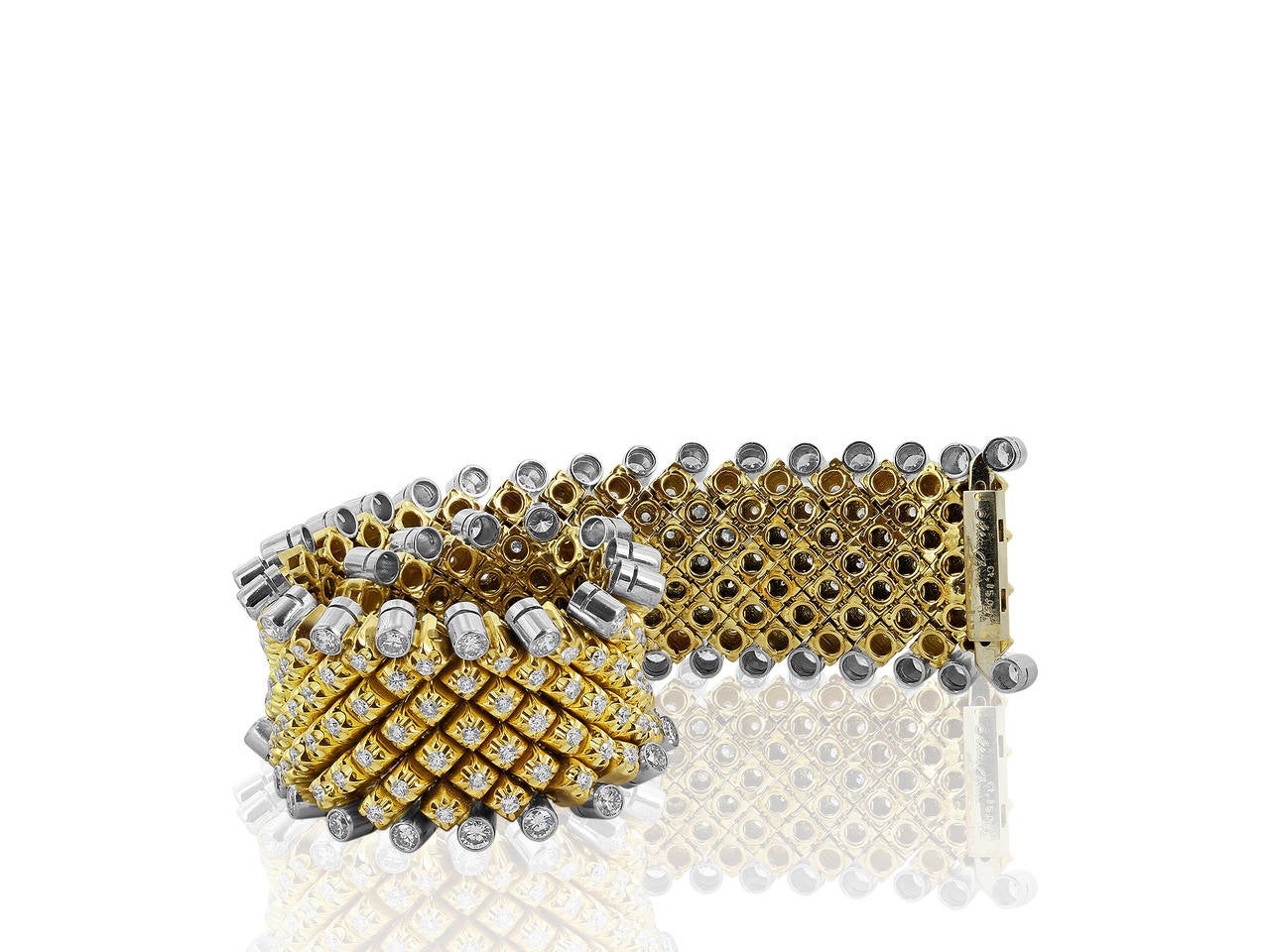 Platinum and 18 karat yellow gold flexible bracelet consisting of 15.06 carats total weight of bezel set round brilliant cut diamonds. Signed Aletto Brother for Shreve, Crump & Low