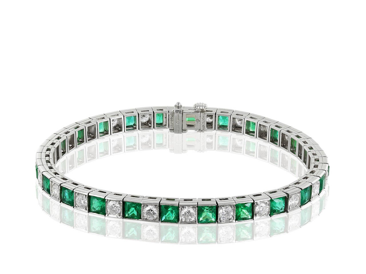 Platinum straight line bracelet consisting of 7.37 carats total weight of square cut emeralds alternating with 2.74 carats total weight of round brilliant cut diamonds having an approximate color and clarity of F-G/VS1-VS2. Signed Oscar Heyman.