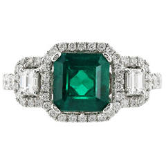 1.63 Carat Emerald Diamond Gold Three Stone Ring