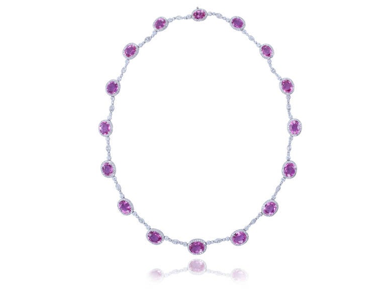Platinum necklace consisting of 16 oval shape pink sapphires having a total weight of 34.62 carats set with 7.40 carats of round brilliant cut and marquise shape diamond.