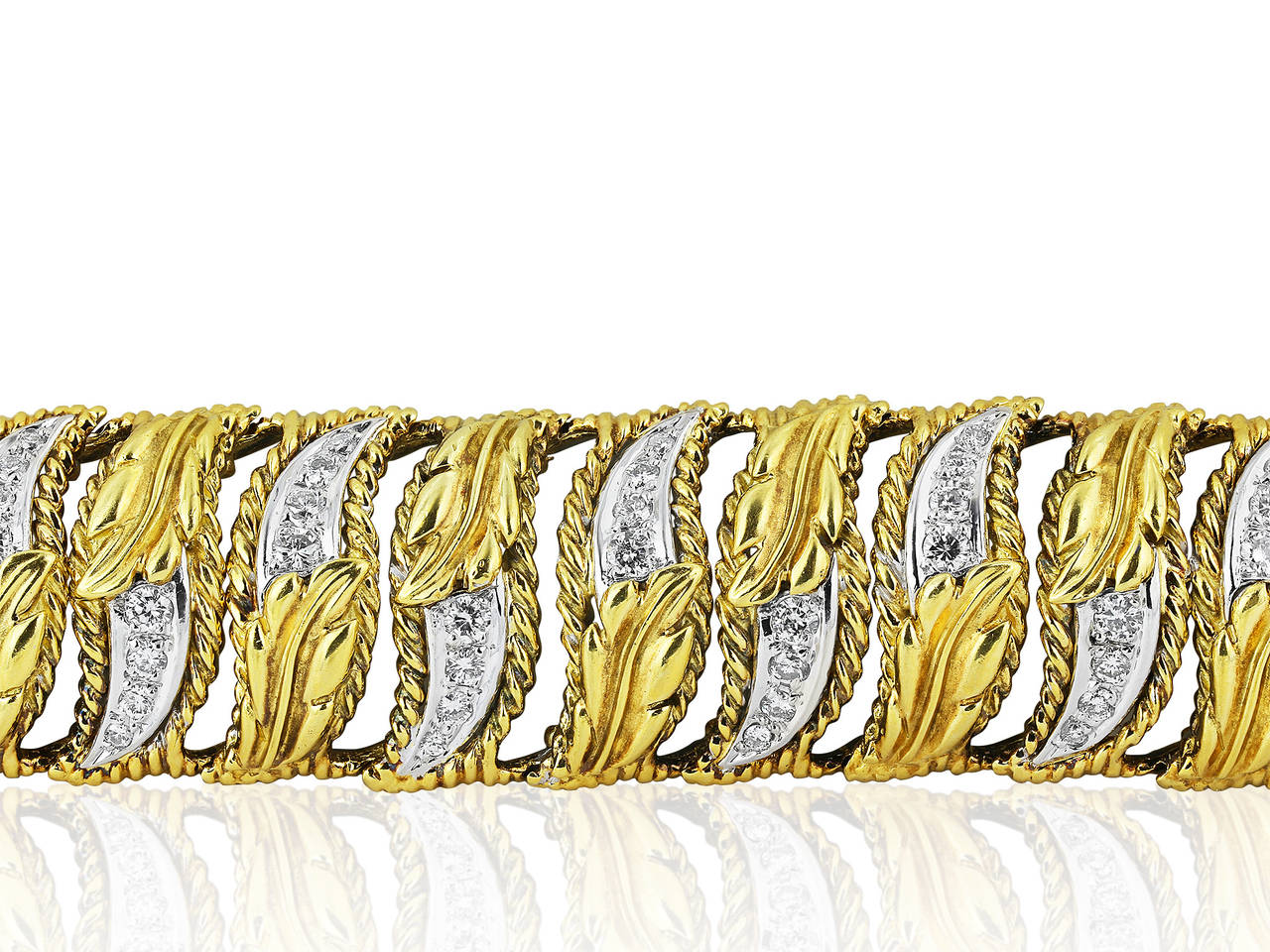 18 karat yellow gold flexible bracelet consisting of 88 round brilliant cut diamonds having a total weight of approximately 3.75 carats accenting a leaf pattern.