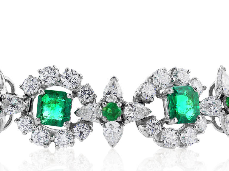 Platinum flexible bracelet consisting of 14.26 carats total weight of round brilliant and marquise cut diamonds set with 8.08 carats total weight of square and round cut Colombian emeralds, signed Oscar Heyman Brothers with letter of authenticity.