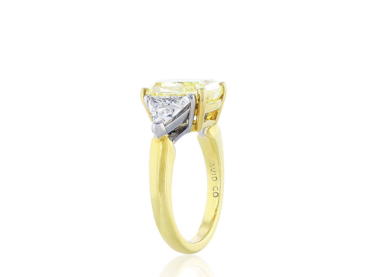 Platinum and 18 karat yellow gold 3 stone diamond ring consisting of one center radiant diamond weighing 4.01 carats having a color and clarity of  FY/VS2, measuring 9.96 x 7.56 x 5.51mm with GIA certificate #11762126.  The center stone is flanked