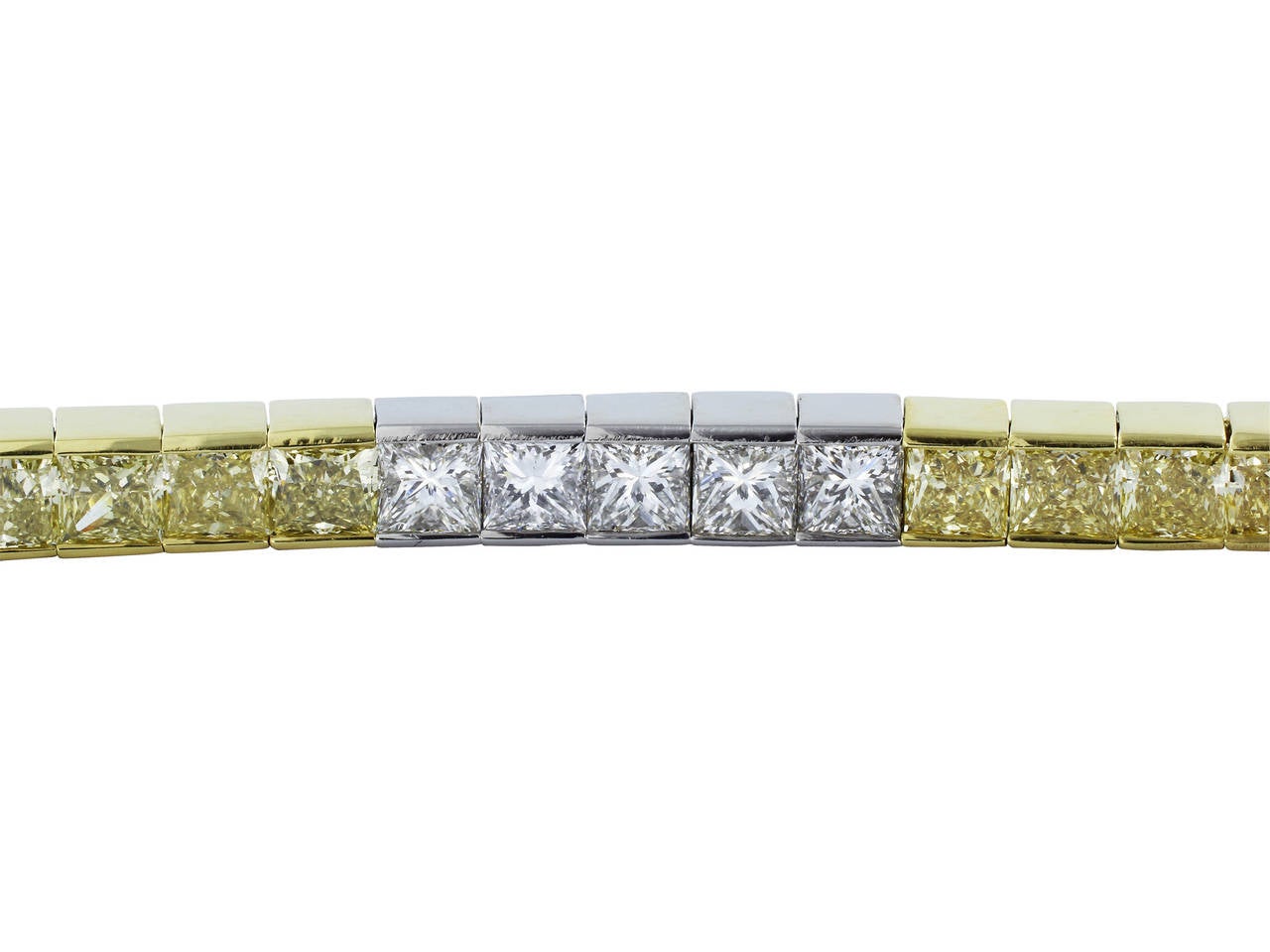 Platinum and 18 karat yellow gold channel set bracelet consisting of 25 radiant cut natural canary diamonds and 25 radiant cut colorless diamonds, total diamond weight for the bracelet is 14.73 carats.