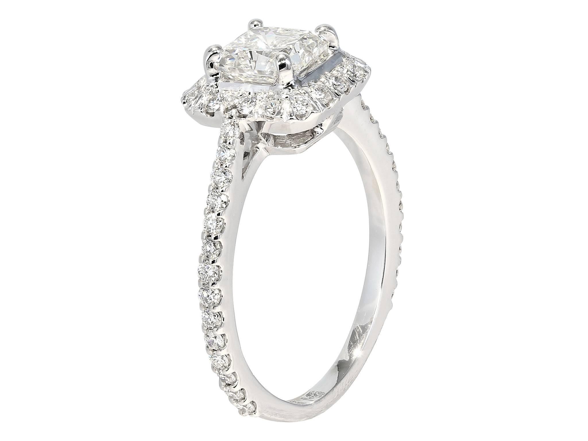 14 karat white gold halo ring consisting of 1 radiant cut diamond weighing 1.03 carats having a color and clarity of H/VS2 with GIA certificate #5111479055, the center stone is set with full cut diamonds surrounding the center stone and going down