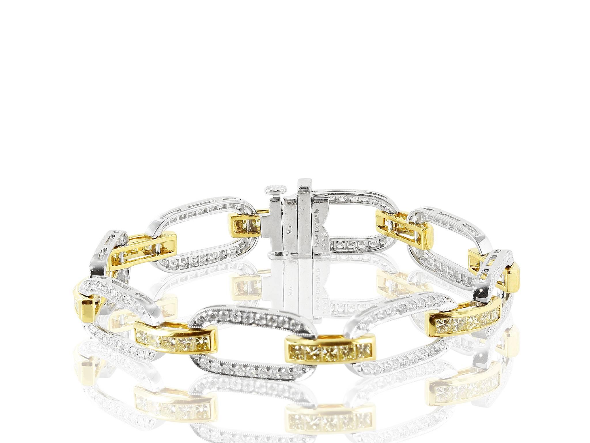 Platinum and 18 karat yellow gold flexible bracelet consisting of 144 round brilliant cut diamonds having a total weight of 1.80 carats set with 40 princess cut canary diamonds having a total weight of approximately 3.03 carats.