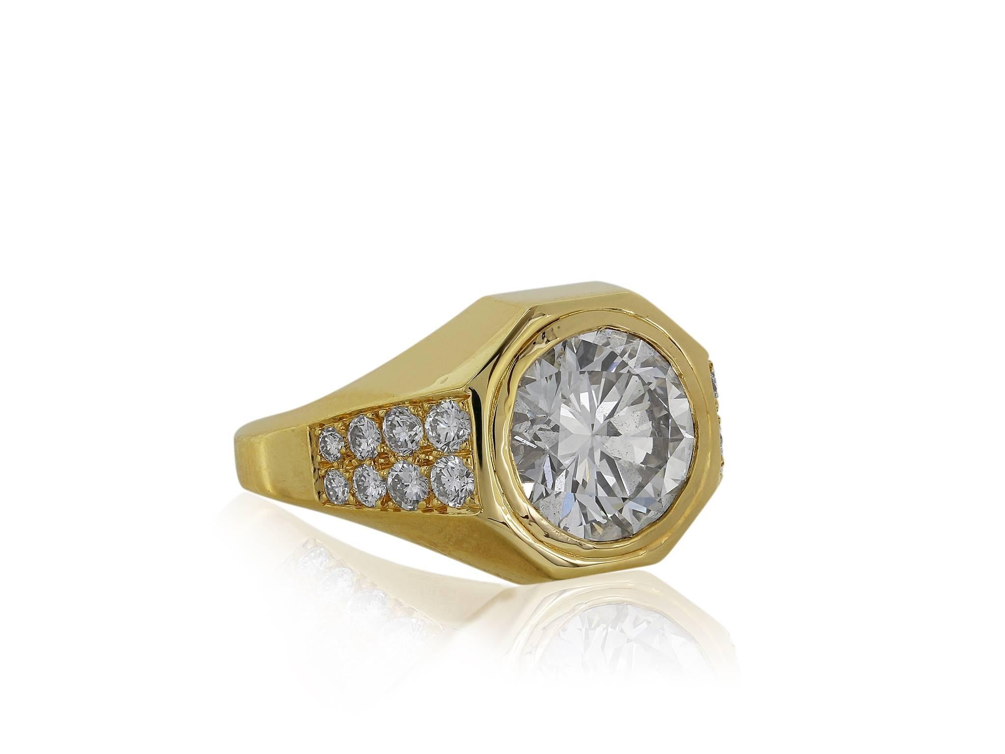 18 karat yellow gold ring featuring one 3.01 carat round brilliant diamond with a color and clarity of I VVS2, respectively flanked by 16 full cut diamonds weighing approximately .24 carats with GIA certificate certificate 5171091312 signed, Bulgari.