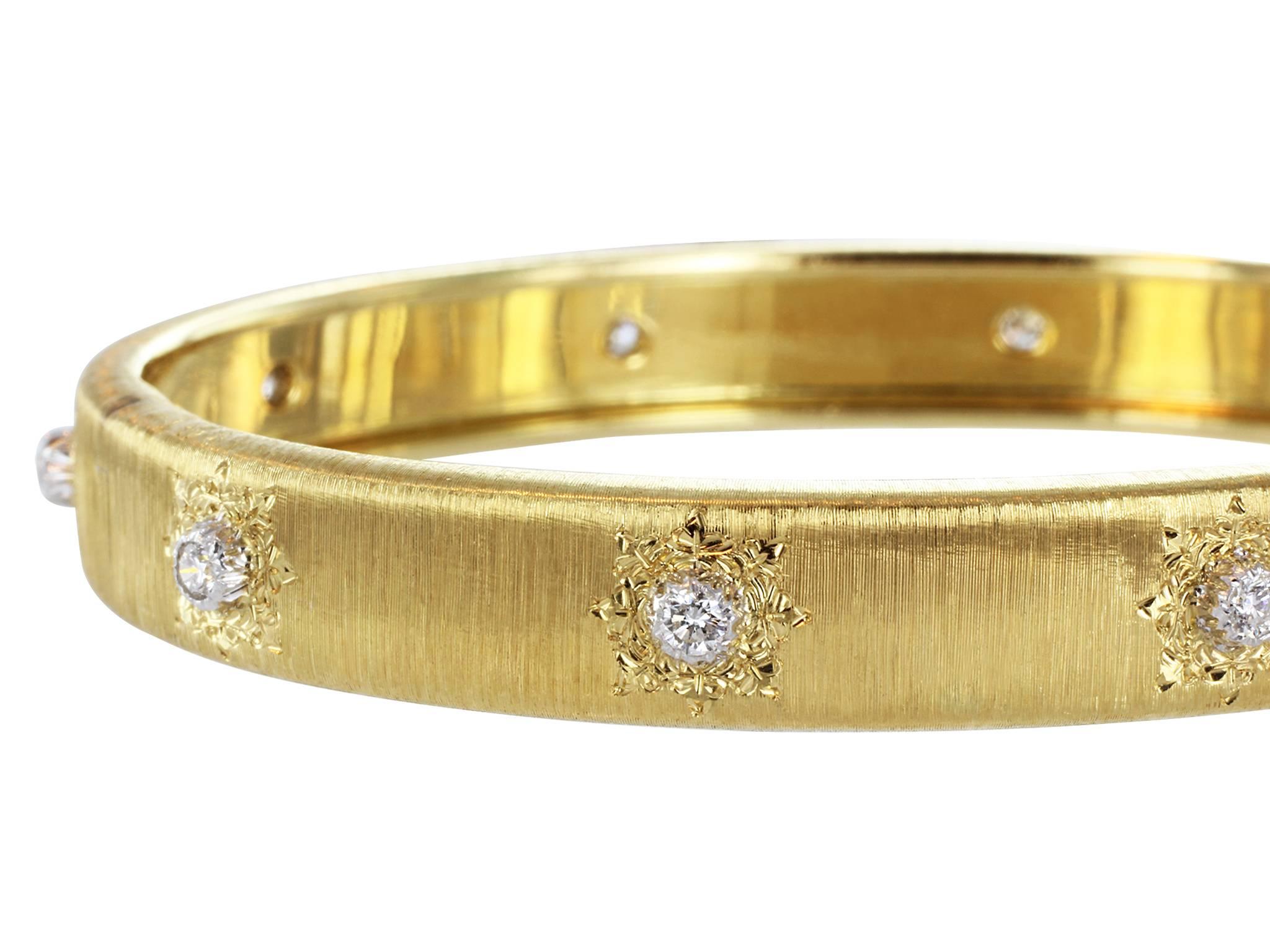 Estate Buccellati Classica design Two tone 18 karat yellow and white gold textured finish bangle bracelet set with 10 round brilliant cut diamonds having a total weight of approximately .50 carats.  Handmade in Italy and signed Buccellati, Classica