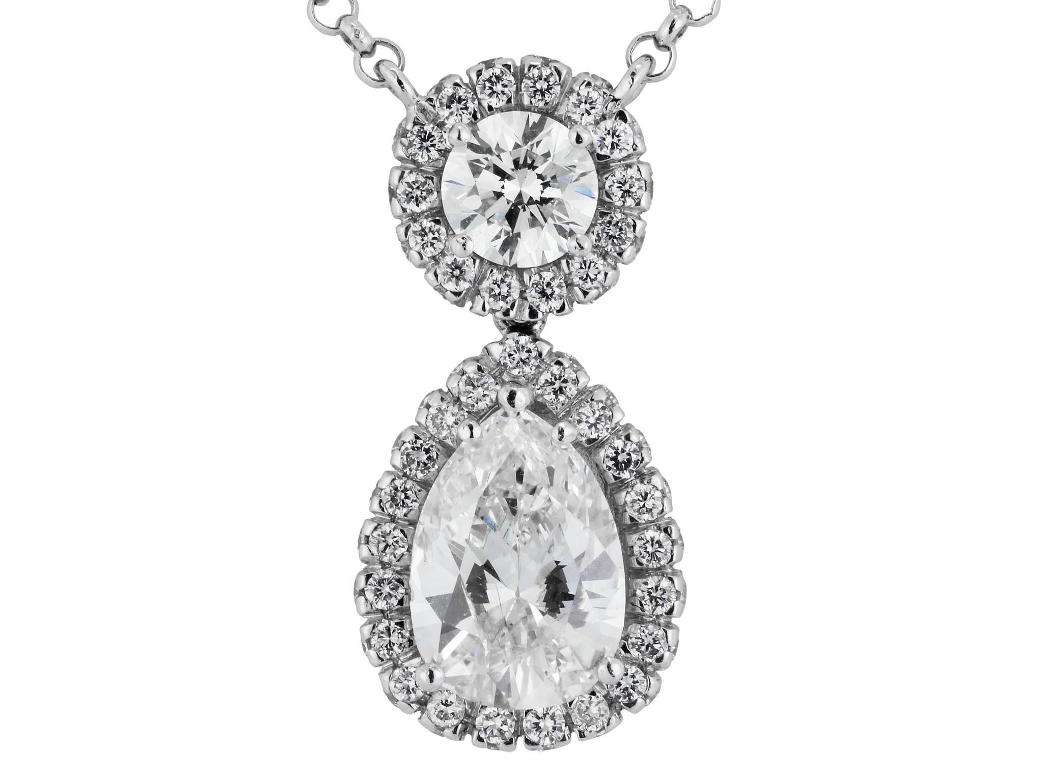 18 karat white gold necklace consisting of 1 pear shape diamond weighing 1.78 carats dropping from 1 full cut diamond weighing .51 carats, both stones are surrounded by 1 row of 91 full cut diamond weighing 1.20 carats, there are 14 rose cut