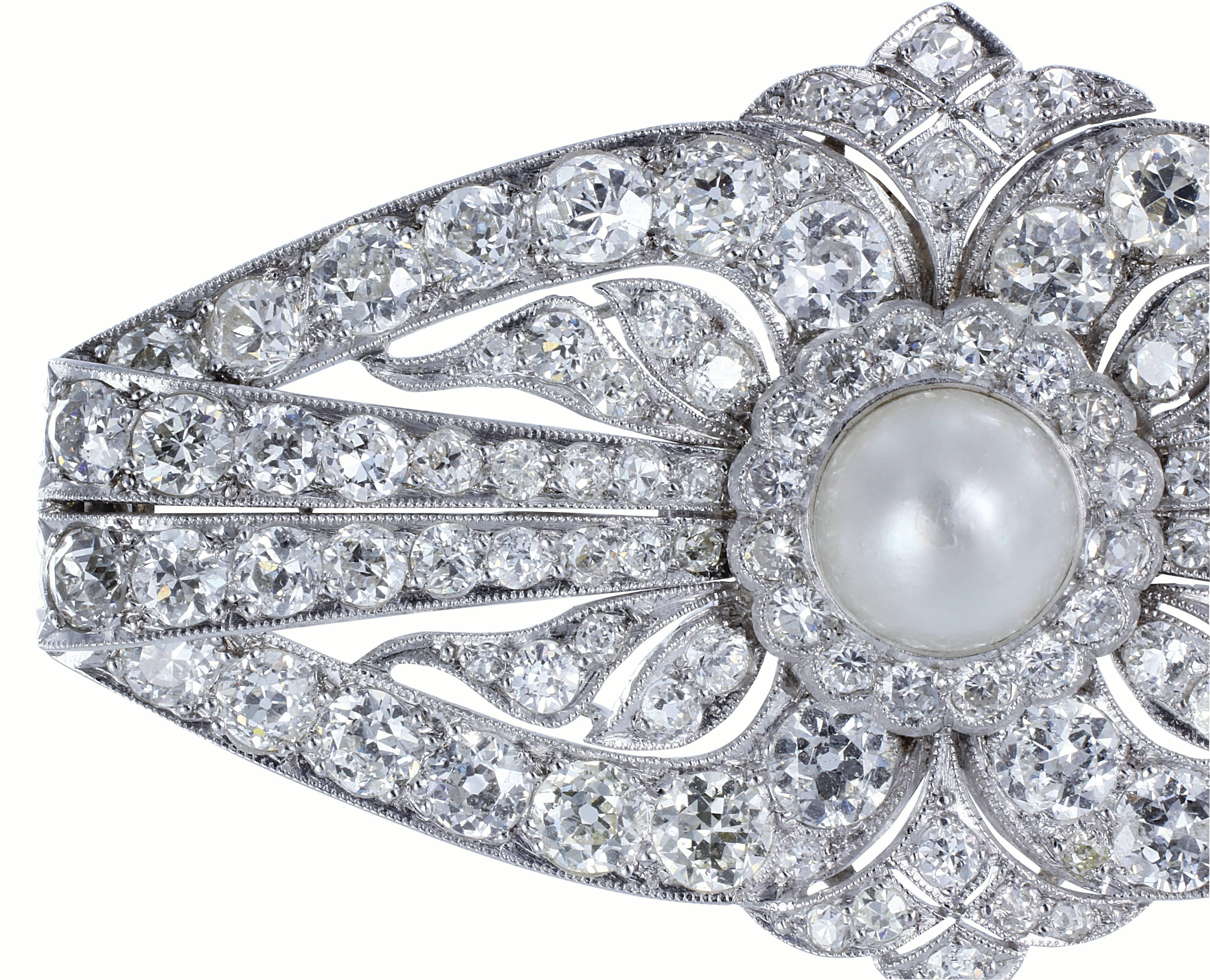 Platinum Art deco pin consisting of 112 old European cut diamonds having a total weight of approximately 6.00 carats set with one 8.40mm natural pearl.