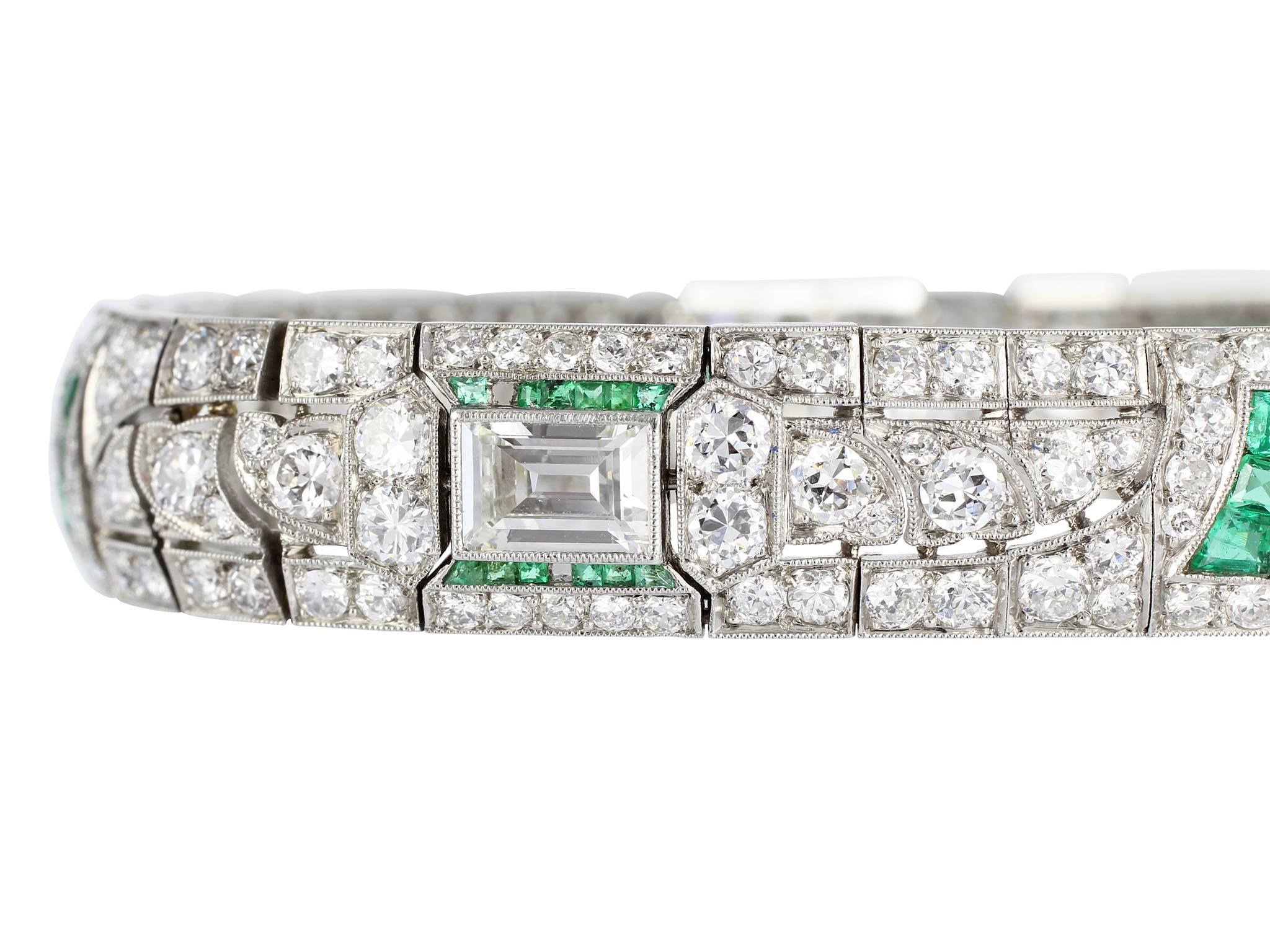 Platinum Art Deco flexible bracelet consisting of 4 emerald cut diamonds having a total weight of approximately 4.00 carat total weight set with 256 old european cut diamonds having a total weight of approximately 10.00 carats set with custom cut