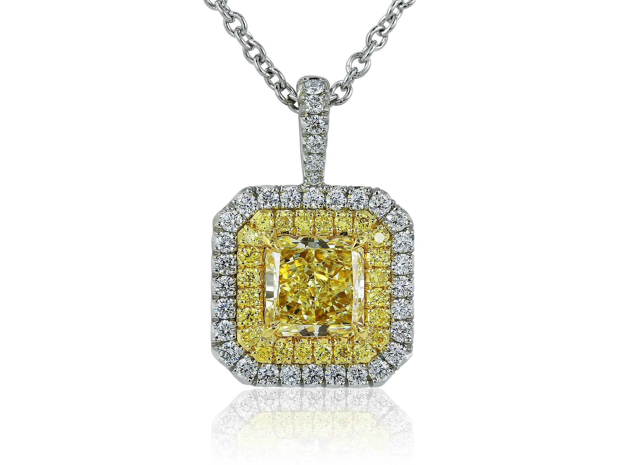 Platinum and 18 karat yellow gold pendant consisting of one Radiant Cut natural canary diamond weighing .01 carat having a color and clarity FY / SI1 with GIA certificate #5161539563, the center stone is set with .40 carats total weight of full cut