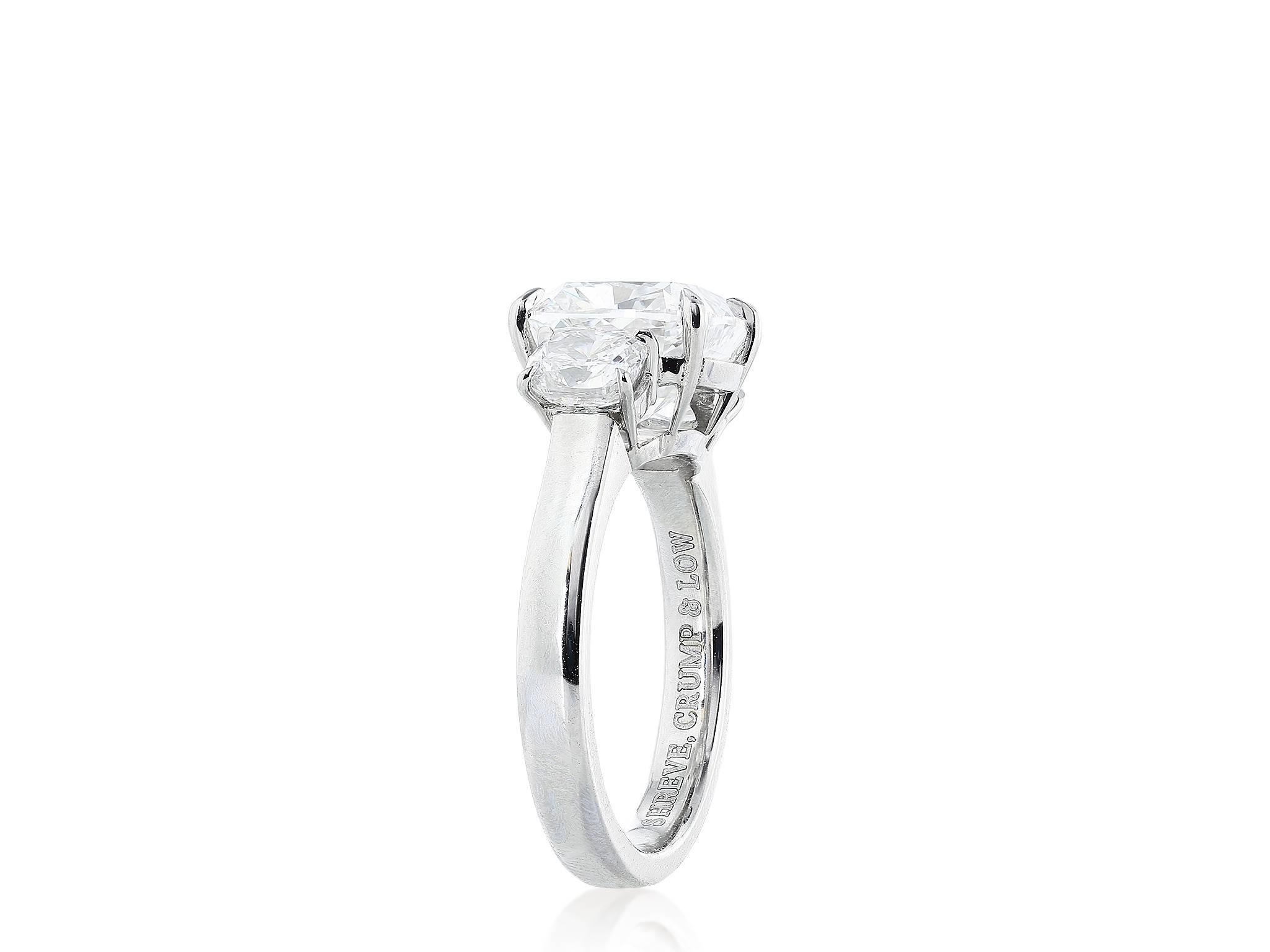 Platinum custom made 3 Stone cushion cut ring consisting of a 4.02 carat center stone having a color and clarity of G/VS2, measuring 9.04 x 8.49 x 6.09mm with GIA certificate #5166824509, flanked by 2 cushion cut diamonds having a total weight of