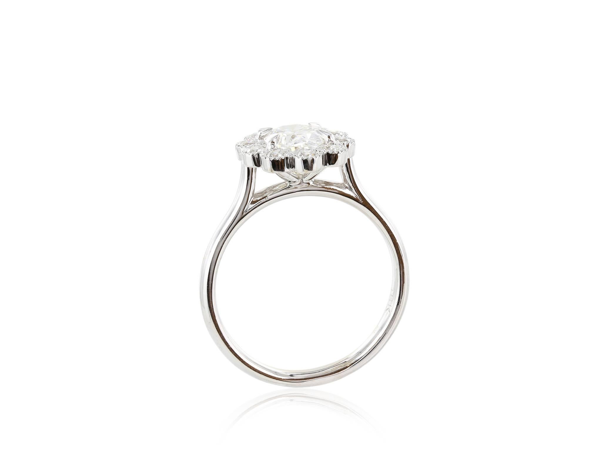 Modern .92 Carat Oval Diamond Gold Halo Ring For Sale