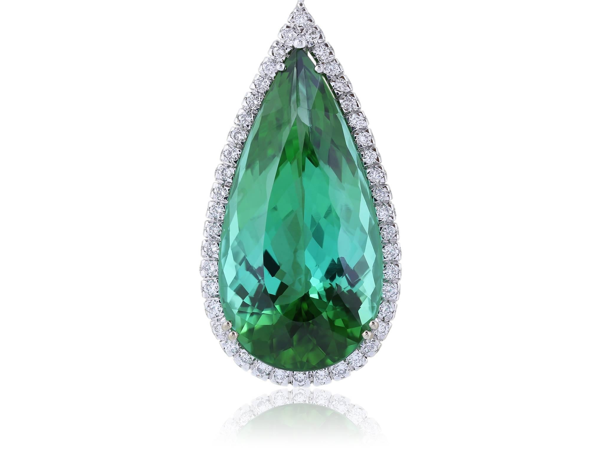 Pendant with pear shaped green tourmaline stone weighing 37.35 carats surrounded by round brilliant diamonds in a halo setting weighing 3.95 carats on a handmade 18 karat white gold chain featuring 2 marquise cut diamonds weighing 1.47 carats and 17