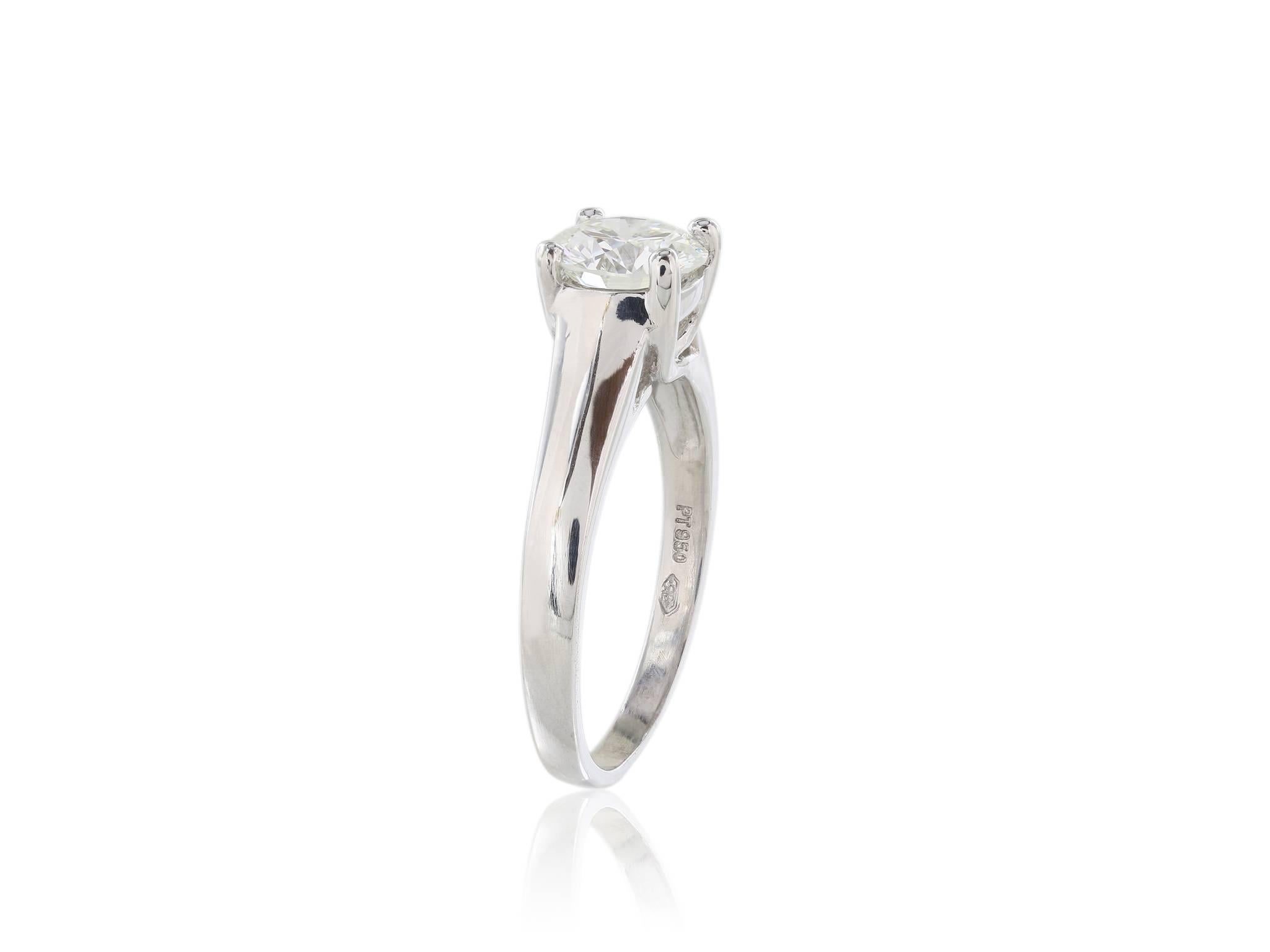 1.13 carat diamond platinum solitaire ring with a color and clarity rating of G/VVS1 .  The diamond has a GIA triple excellence rating for cut, polish and symmetry.