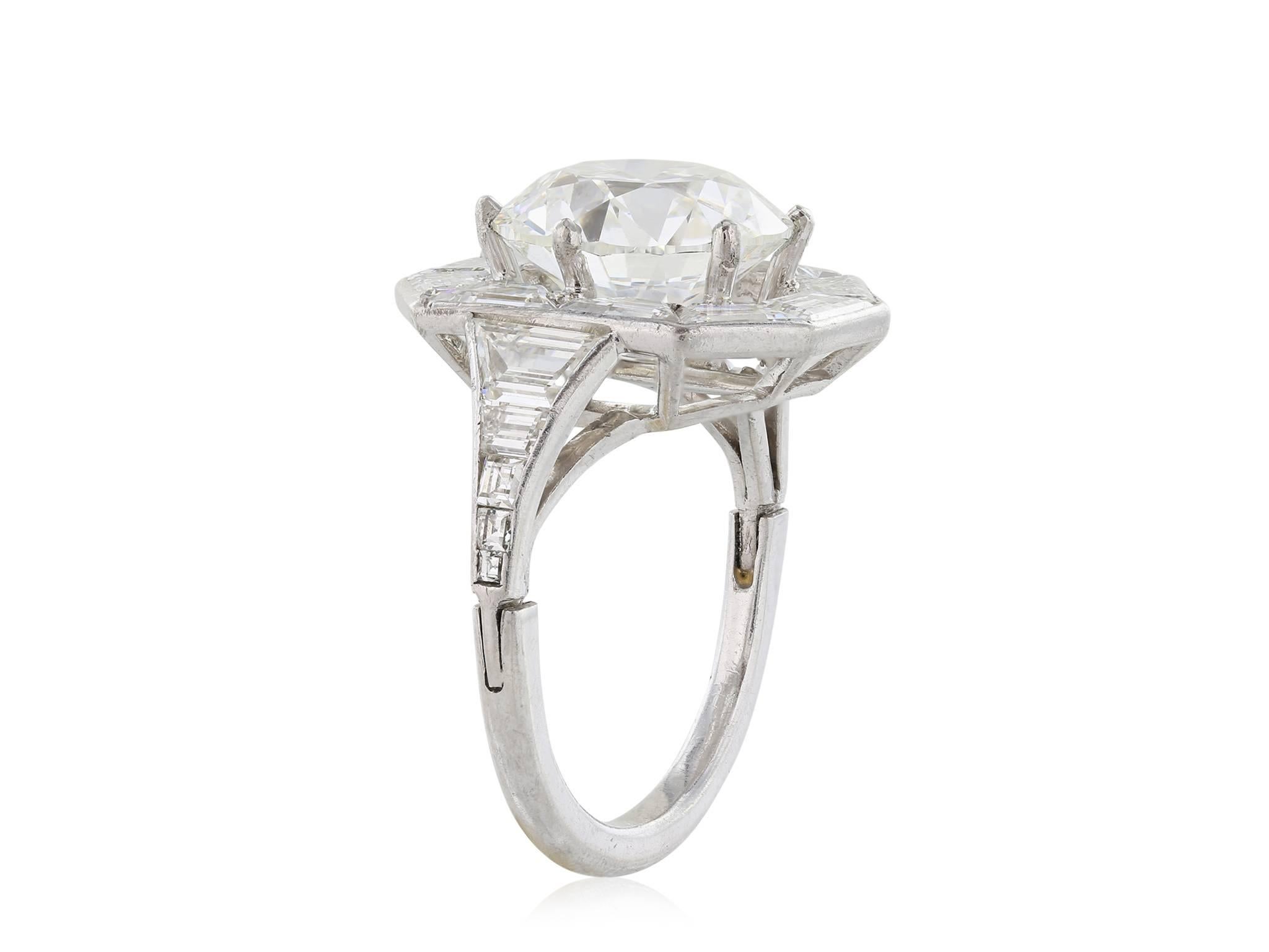 Platinum diamond ring, featuring one Old European Cut diamond weighing 4.92 with a color and clarity of I SI2 GIA report# 5171198148 carats set in a mounting with 20 baguettes weighing approximately 2.25CTW.