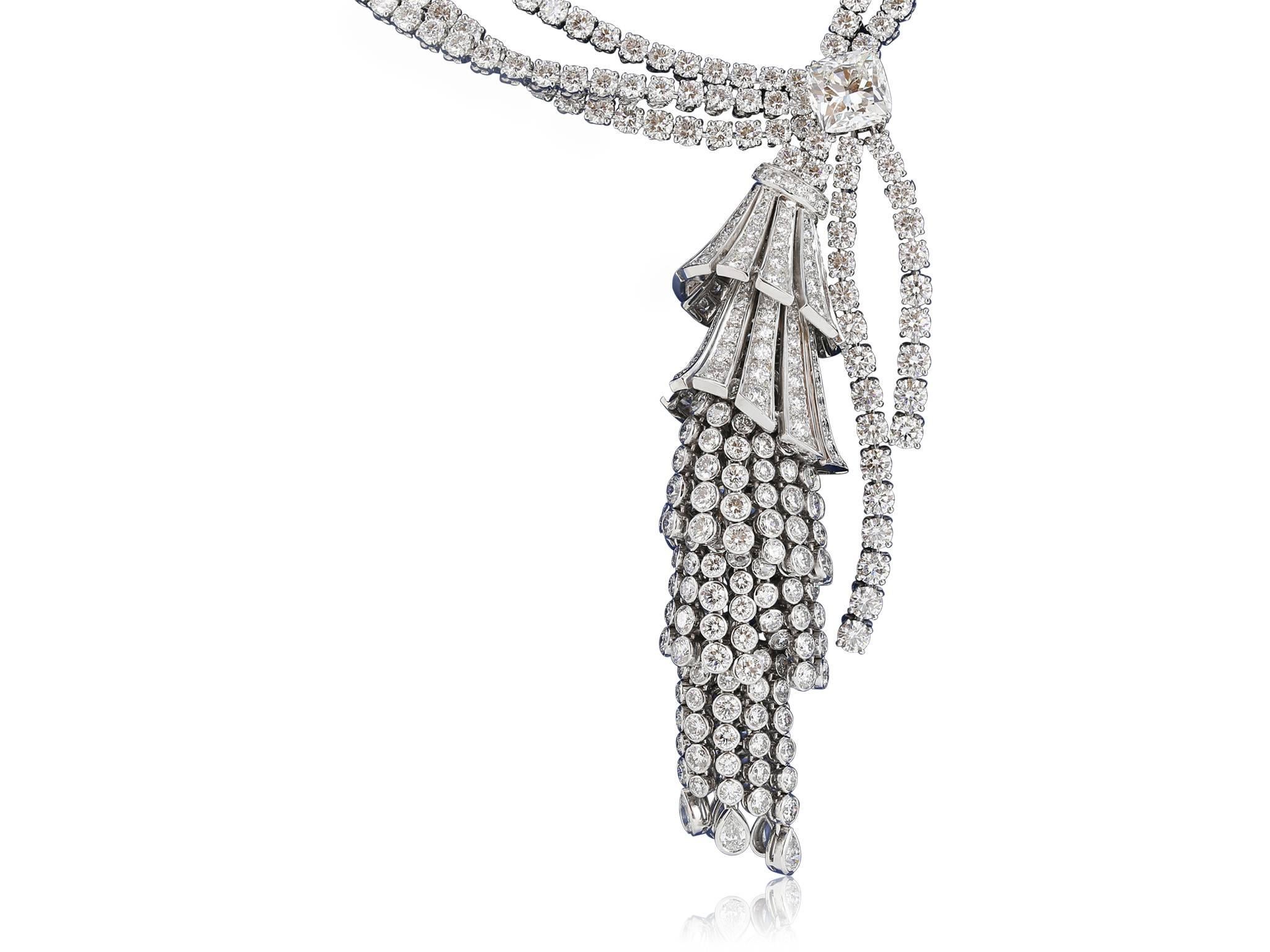 18 karat white one of a kind Boucheron estate diamond tassel necklace,  with 6 groups of diamonds, cascading down the multi strand tassel, diamond paves, round diamond bezels and finishing with pear shape diamond bezels. The necklace has 3 rows of