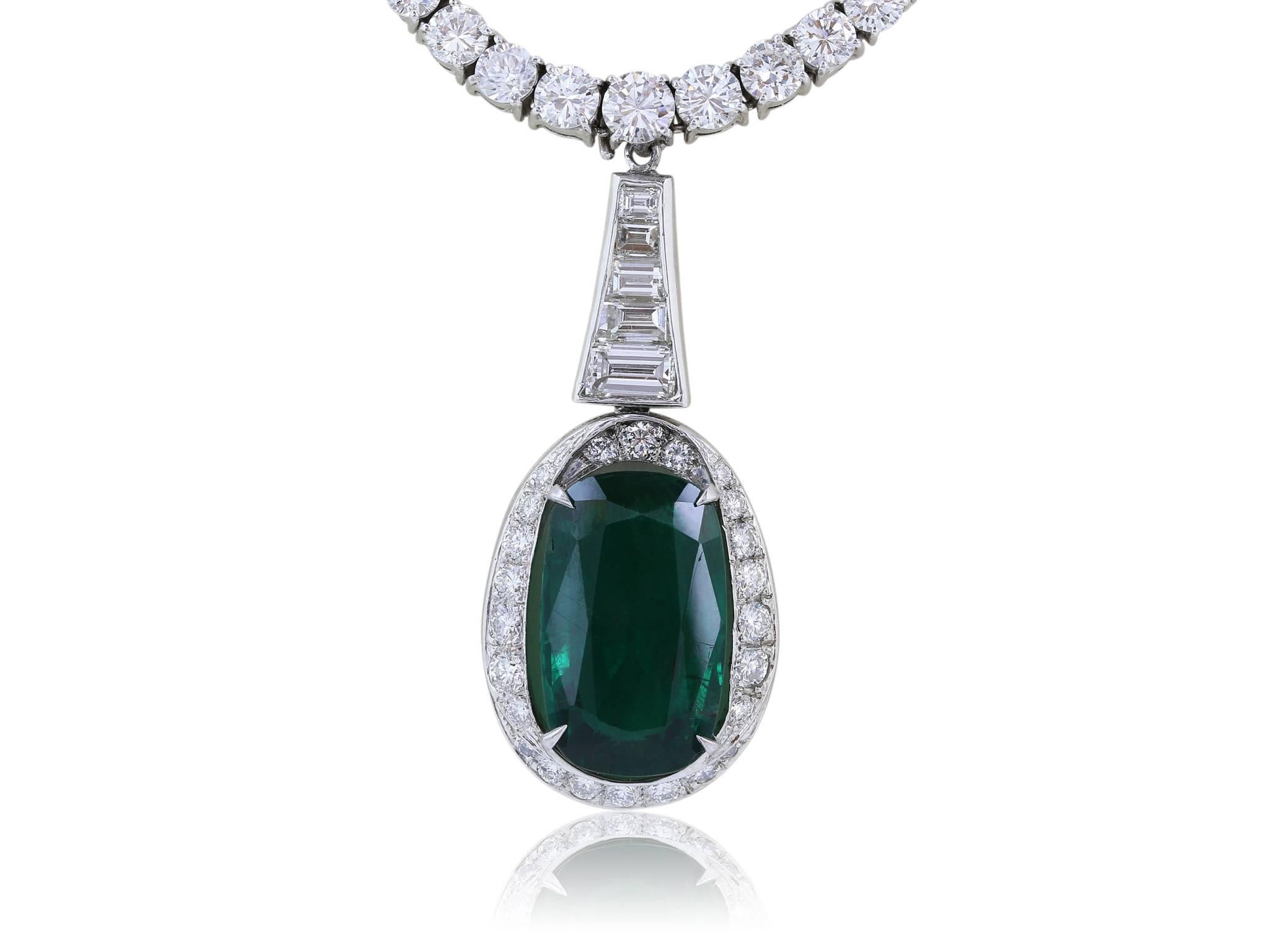Platinum graduated Riviera diamond necklace, consisting of approximately 12 carats total weight of prong set full cut diamonds, 133 round diamonds and 1 marquis cut diamond on the clasp, featuring a detachable 8.09 carat cushion cut Emerald drop