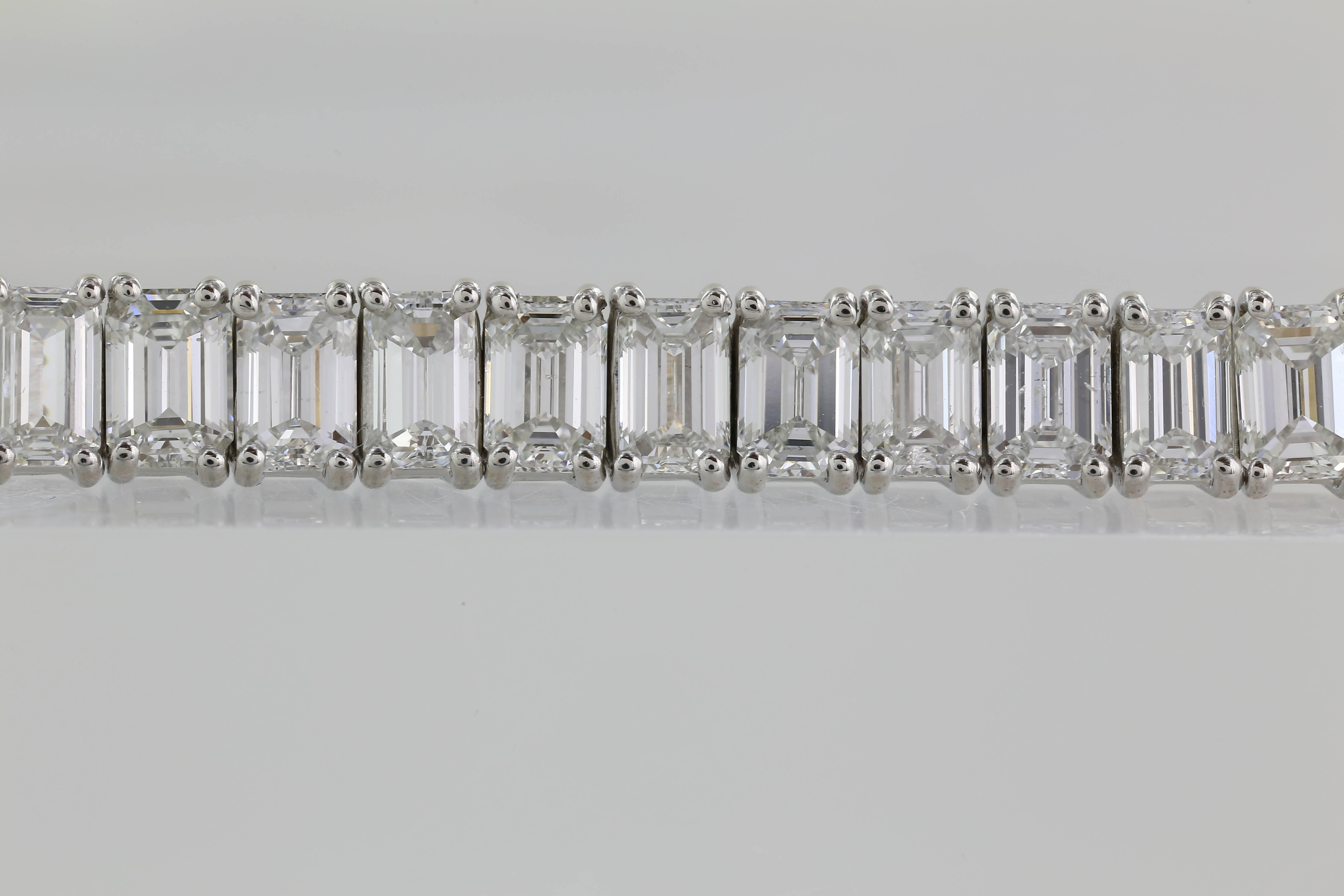 Platinum set 16.57 carat emerald cut diamond bracelet featuring 52 diamonds all with a color of E-F and a clarity of VS1-VS2