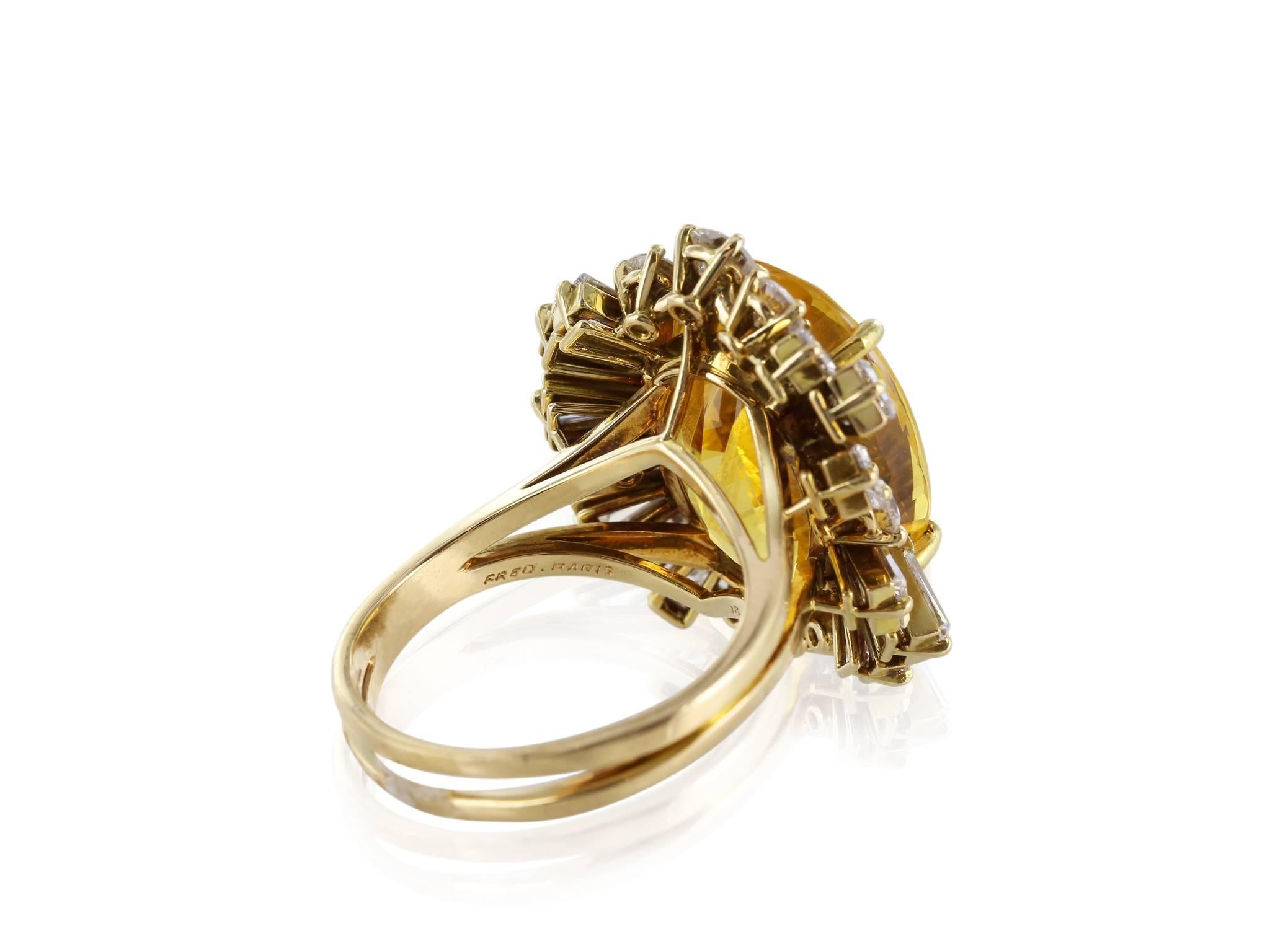 18 Karat yellow gold signed Fred of Paris 22 carats golden sapphire ring with a halo of approximately 3.25 carats of mixed baguette and round brilliant cut diamonds.