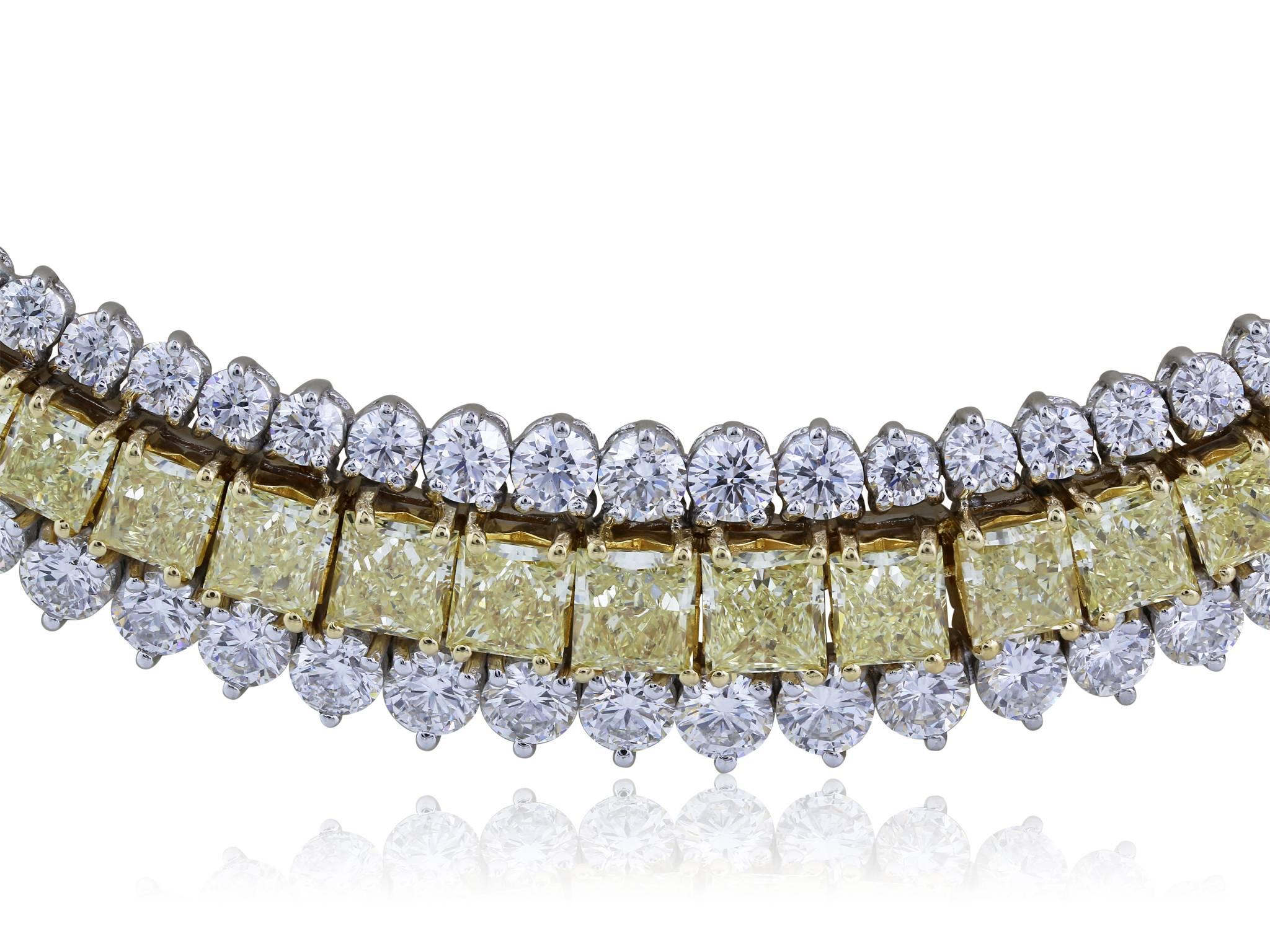 Platinum and 18 karat yellow gold collar necklace featuring a graduated row of 53 radiant cut natural canary diamonds, weighing 14.46 carats, flanked by two rows of round brilliant cut diamonds with a total carat weight of 23.57 carats.