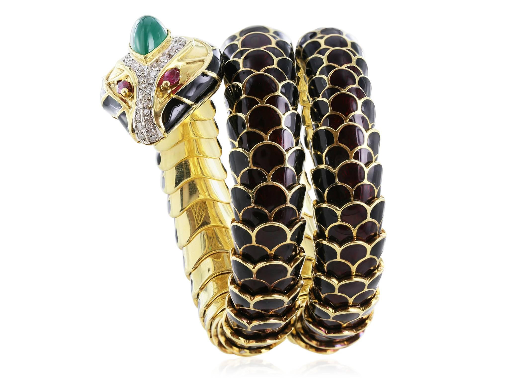 18 karat yellow gold heavy black enamel, green cabochon emerald, diamond, and ruby eye flexible snake bracelet. Natai