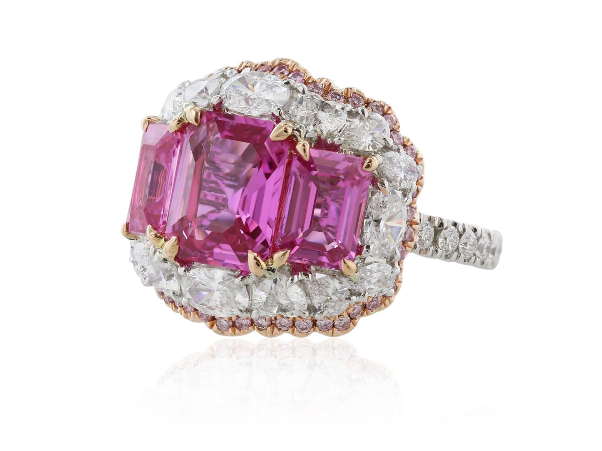18 karat white gold custom made ring consisting of 1 asscher cut unheated pink sapphire weighing 2.91 carats, GIA 7192170427, flanked by 2 unheated pink sapphires with a total weight of 2.43 carats, GIA 1137696507 + 6132696400, surrounded by pear,