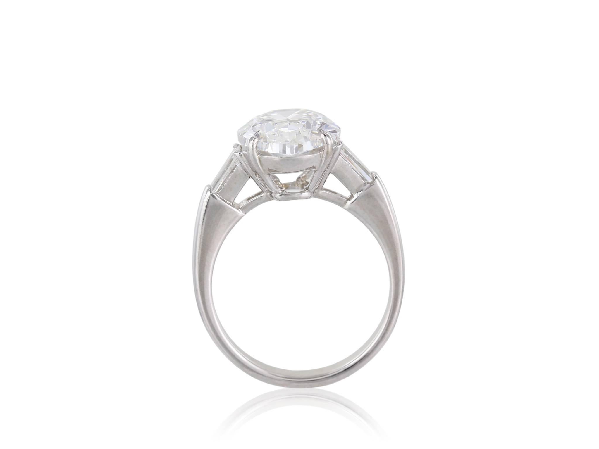 Contemporary GIA Certified 5.02 Carat Oval Diamond Platinum Engagement Ring For Sale