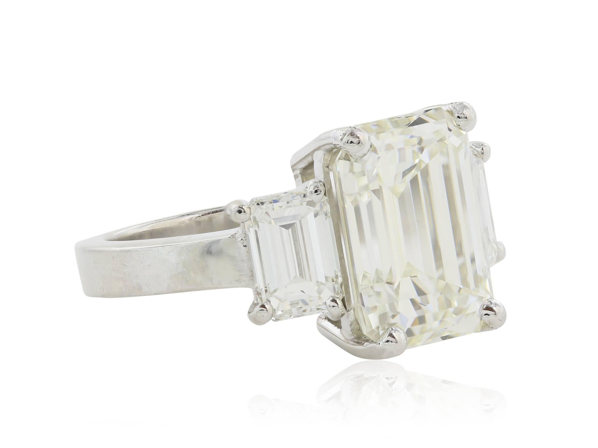 GIA Certified 6.36 Carat Emerald Cut Three Stone Diamond Ring In Excellent Condition In Chestnut Hill, MA