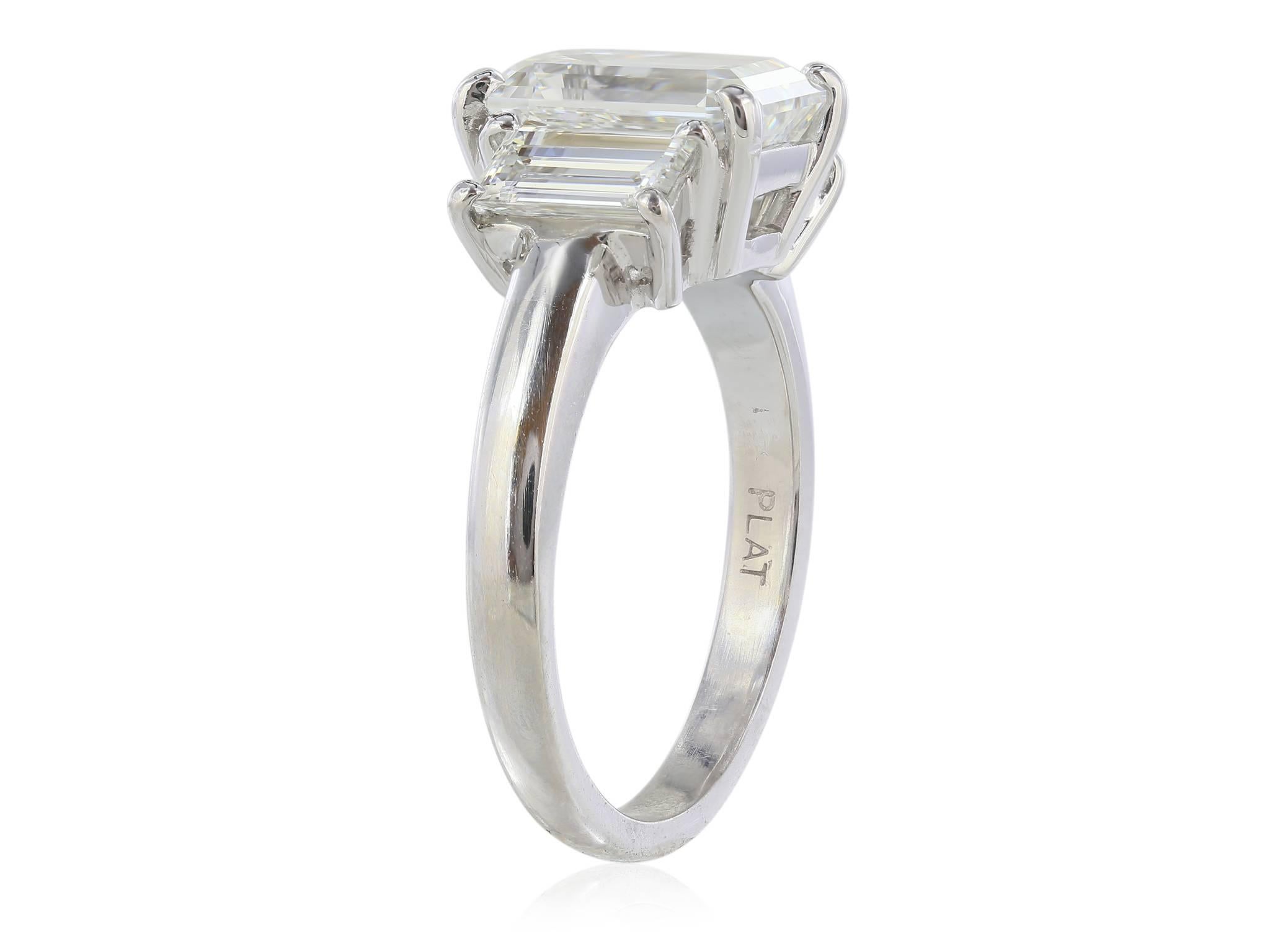 emerald cut three stone ring