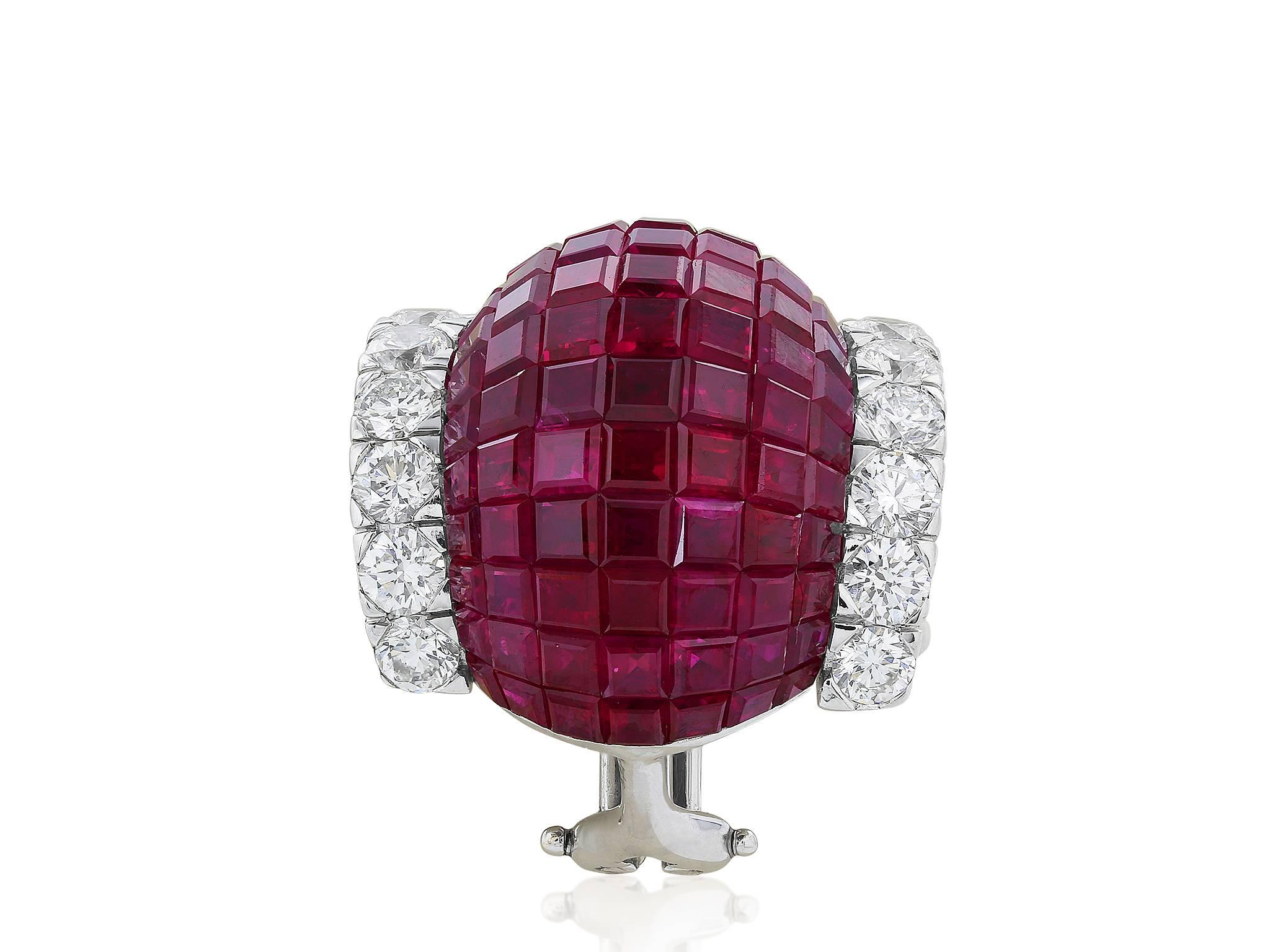 18 karat white gold clip earrings consisting of 182 invisible square cut rubies having a total weight 16.59 carats set with 36 round brilliant cut diamonds having a total weight of 1.58 carats.