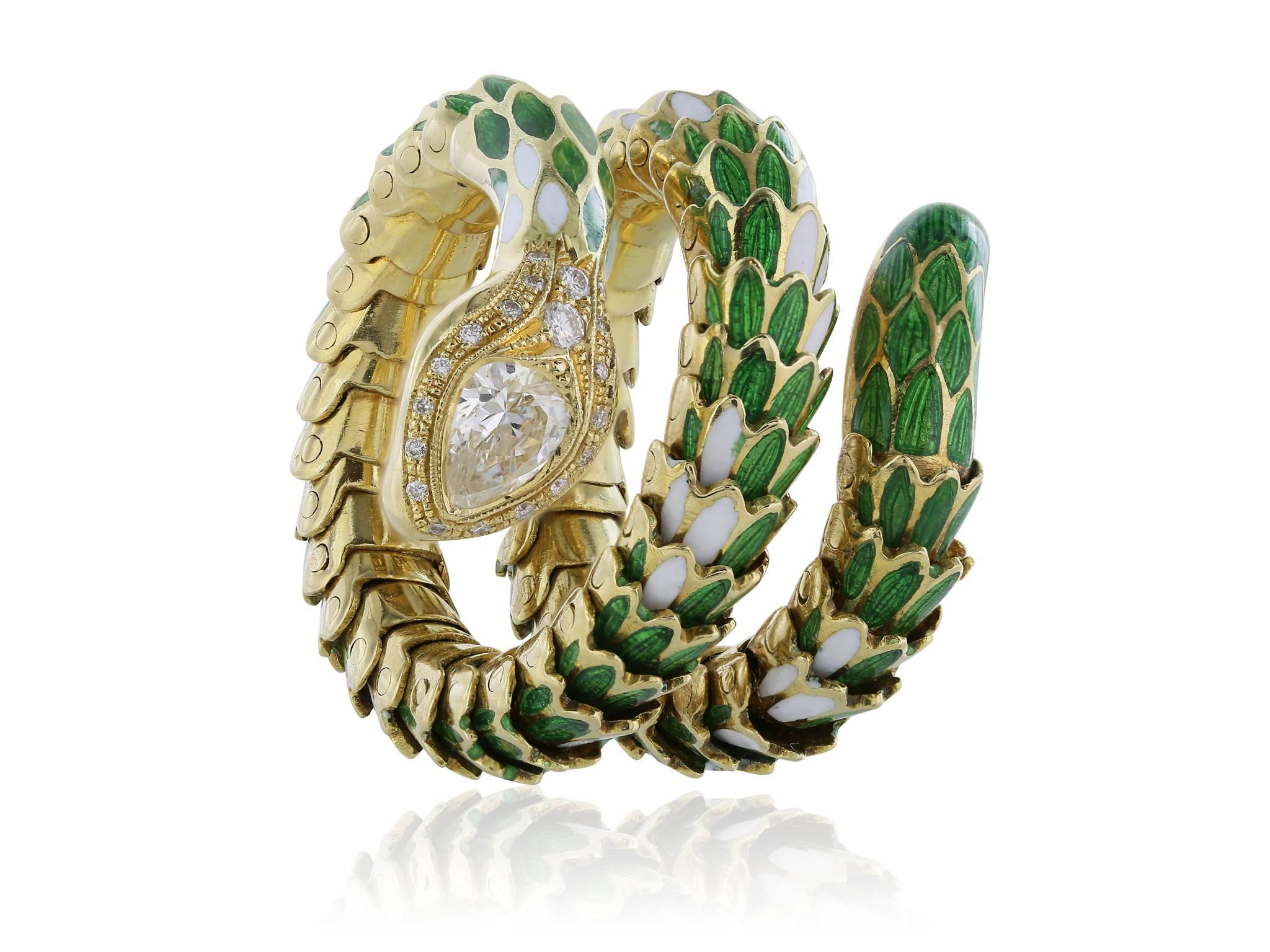 18 karat yellow gold flexible snake ring, featuring enamel green and white coiling scales, with a pear shape diamond bezel set, approximately 0.57 carats G-H color, VS1, VS2 clarity and surrounded by 19 pave round diamonds with an approximately
